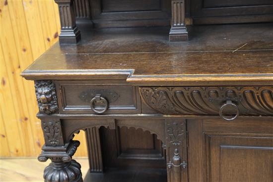 A late 19th century large carved oak breakfront sideboard, W.7ft 9in.